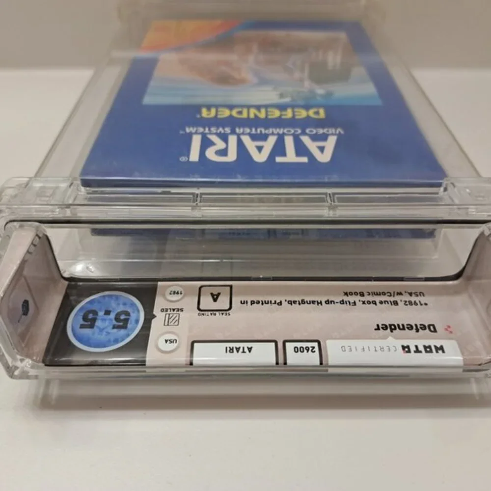 Atari 2600 DEFENDER - EARLY HANGTAB BLUE BOX! WATA GRADED 5.5! NEW & UNOPENED!